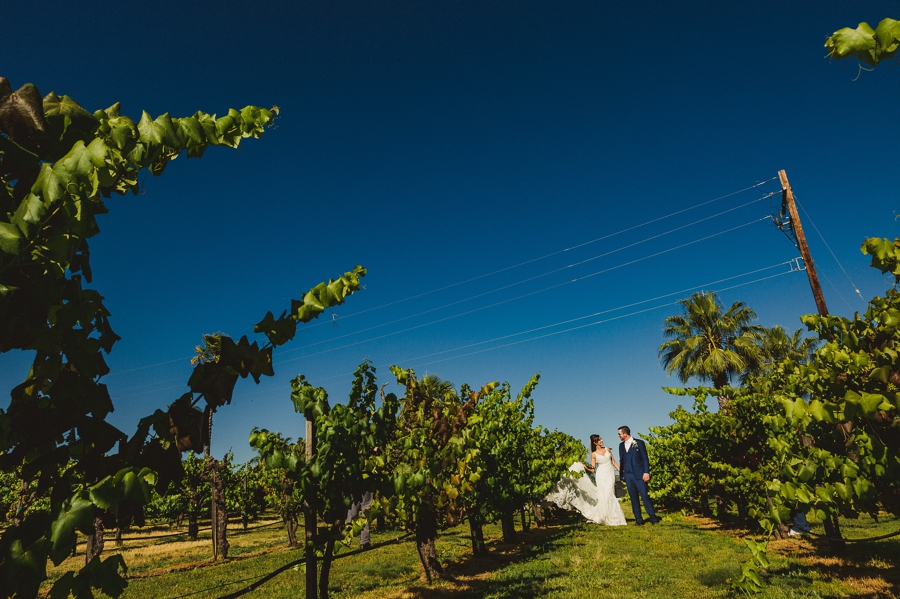 Bride and groom dancing in vineyard at Copper River Country Club