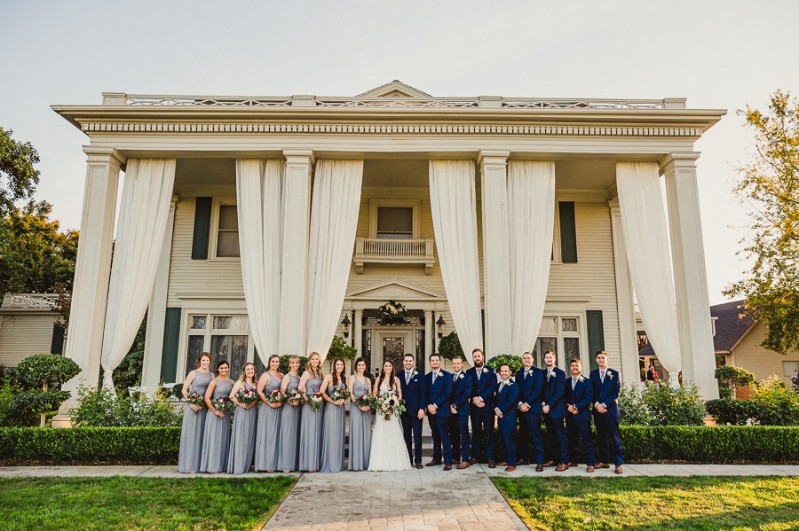 Wedding party portrait in front of The Manor Estate in Madera CA